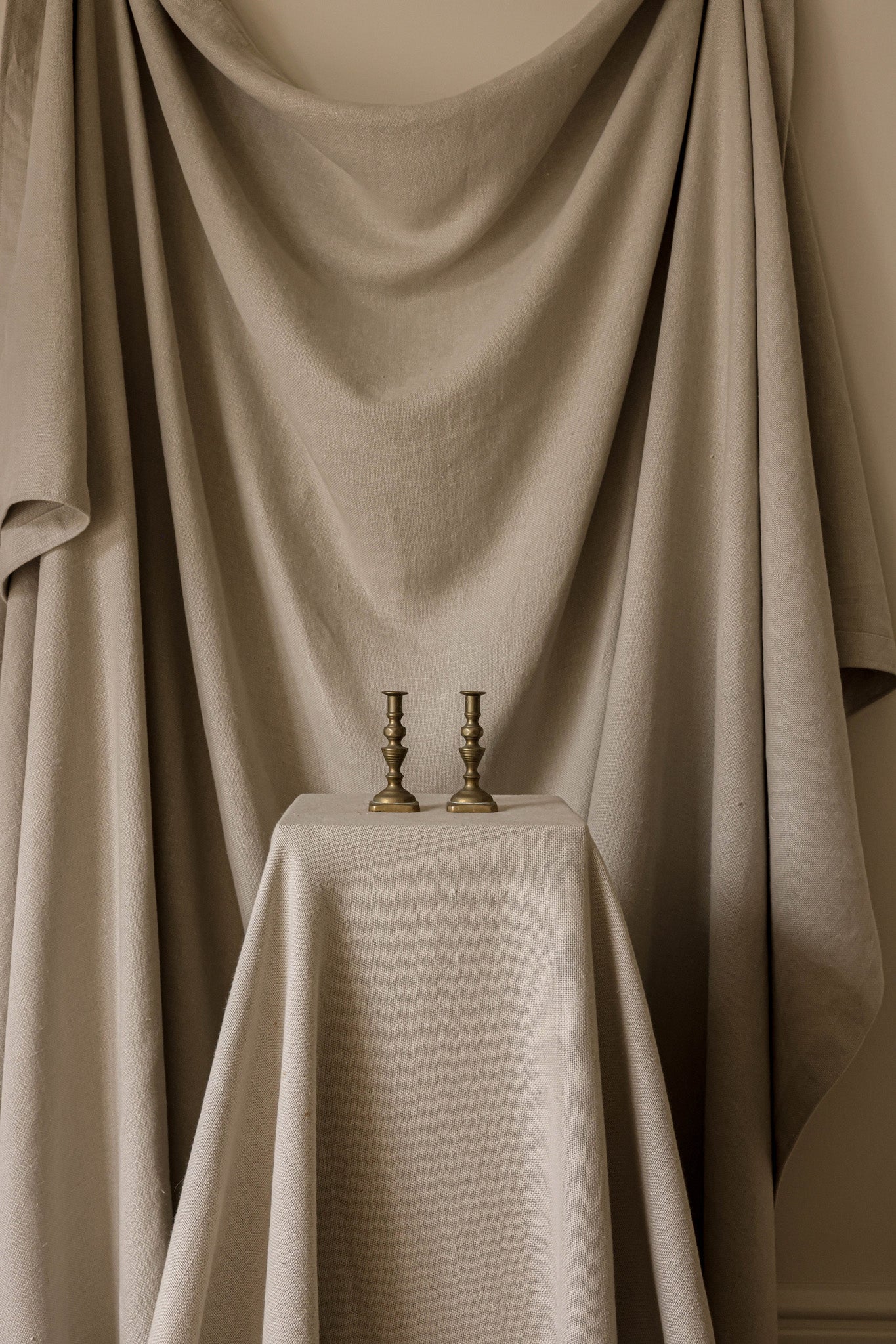 A Pair of Antique Sculptural Brass Candlesticks